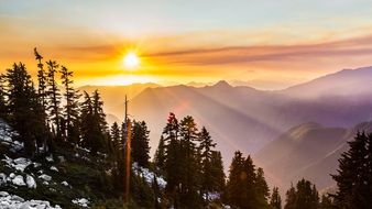 sunrise over snowy mountains