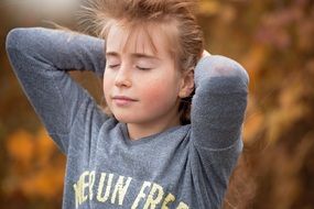 girl with hands behind her head