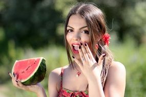 young woman eating watermelon