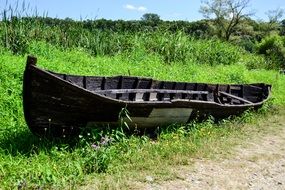 old boat on the grass on a sunny day