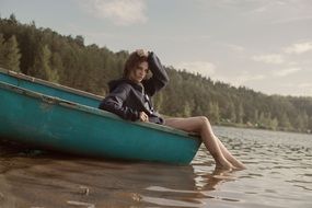 girl in turquoise boat