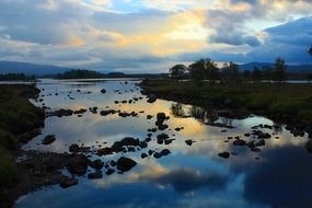 lake in the highlands of scotland at dusk