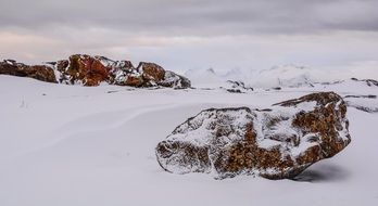 rocks in the snow in winter