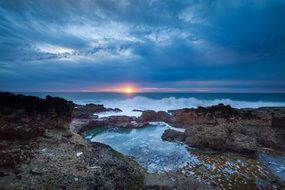 pink sunrise and non-new sky over the coast