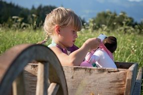 Picture of Child Girl is playing with a toy