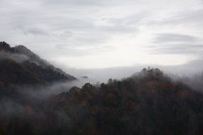 rainy clouds over dark hills