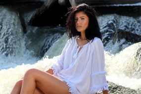 girl in white near the water cascade