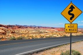 yellow Road Sign in desert landscape