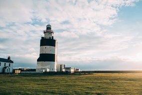 Lighthouse on the landscape of the shore