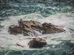 rocky formations in the ocean on the coast in Portugal