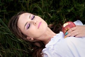 girl with an Apple sleeping on the field