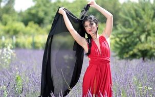 brunette in red dress with black shawl