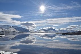 sun over the lake in winter