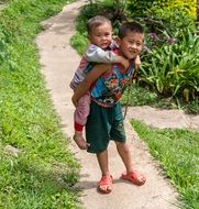 boys on a path in thailand