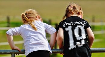 Girls in white and black clothes doing gymnastics in Germany
