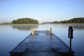 Dock near Lake with Sky Reflection