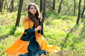 model in princess dress in the spring forest