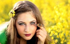 butterfly on the finger of a beautiful girl