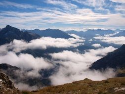 Clouds among Mountain peaks, landscape
