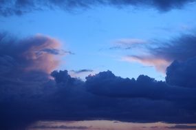 dark clouds on the blue sky