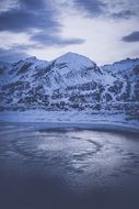 frozen lake at snowy Mountains