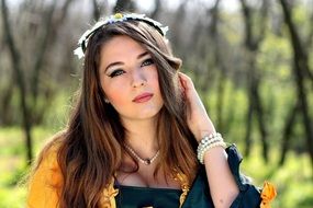 dark blonde woman with flower wreath