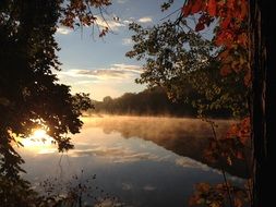 fog over the lake at sunset