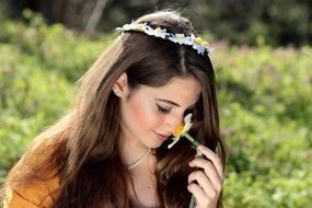 beautiful model smelling spring flower