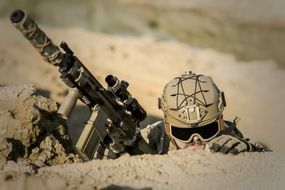 soldier with guns in the desert close up