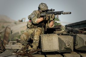 military with weapons on equipment