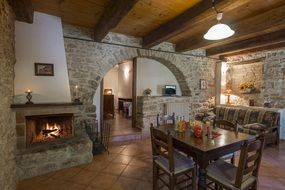 stone interior of a living room with fireplace