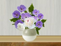 Purple and white flowers in a pot