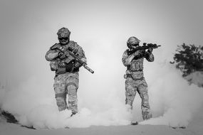 two military in the desert in black white background