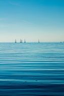 boats on calm ocean water