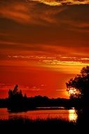 orange sunset on a lake in canada