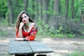 Resting beautiful girl in a forest