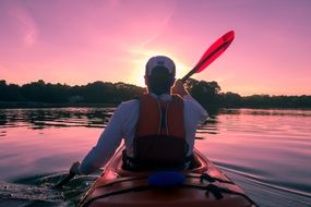 kayaker on the pink lake