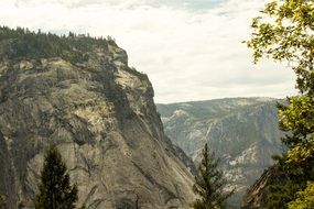 Mountain Tops at cloudy sky
