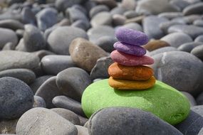 colorful stones on the ocean coast close-up on blurred background