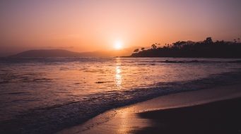 orange sunset on a sandy beach