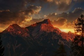 mountains twelve heads on a sunset background