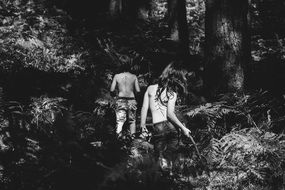 children in the forest black and white photo