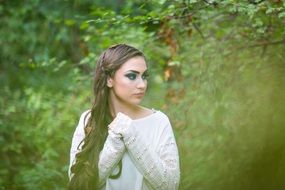 portrait of a long haired lady in forest