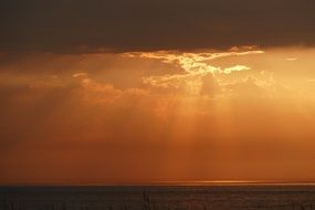 landscape of sunset through the clouds over the Baltic Sea