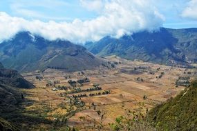 valley in the mountains with green trees