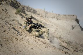 soldier with gun in desert