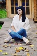 girl sitting on a wooden floor