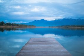 wooden pier on freshwater lake chiemsee
