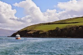 scenic landscape with boat and hillside