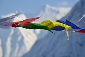 tibetan prayer flags on top of a mountain
